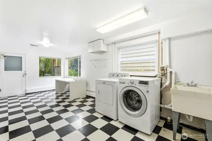 A large laundry room offers excellent functionality with ample space for storage and organization.