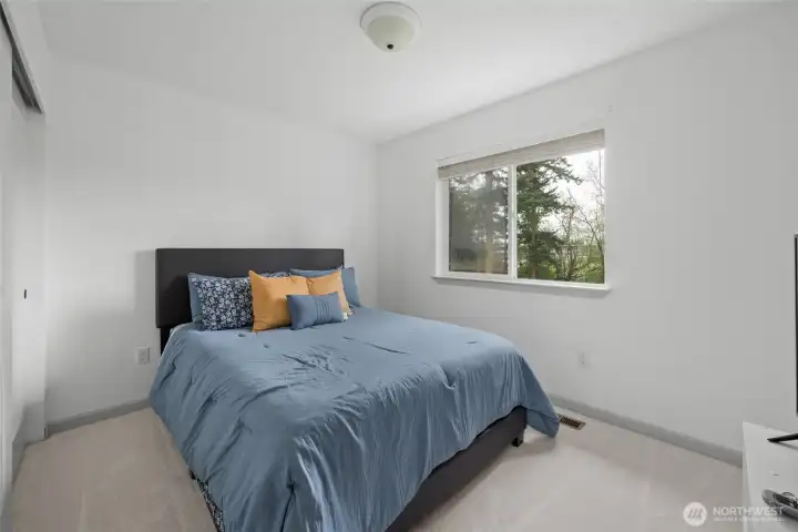 Guest bedroom looks out over back yard