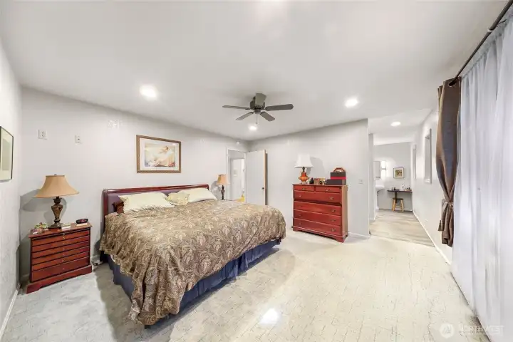 View into walk-in closet and en-suite bath