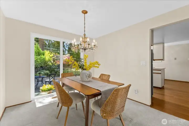 A large sliding glass door connects the dining area to the beautiful backyard patio, creating an easy indoor-outdoor flow A large sliding glass door connects the dining area to the beautiful backyard patio, creating an easy indoor-outdoor flow