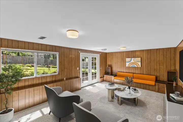 The versatile lower-level bonus room features a large picture window and French doors leading to the beautiful backyard. Virtually staged for inspiration The versatile lower-level bonus room features a large picture window and French doors leading to the beautiful backyard. Virtually staged for inspiration
