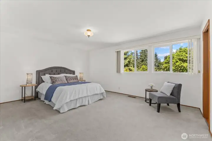 Spacious primary suite featuring oversized picture windows, large walk-in closet and a private 3/4 bath Spacious primary suite featuring oversized picture windows, large walk-in closet and a private 3/4 bath