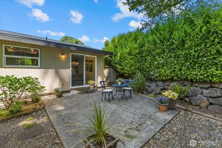 Private patio surrounded by mature landscaping and lush greenery, creating a peaceful outdoor retreat Private patio surrounded by mature landscaping and lush greenery, creating a peaceful outdoor retreat