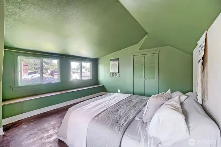 Upstairs, an extra large bedroom with built in storage window seat plus an in-wall closet and custom closet system.