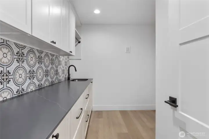 Utility room with tons of counter space and storage