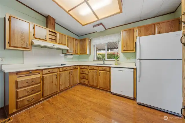 Good size kitchen with lots of cupboards and counter space.