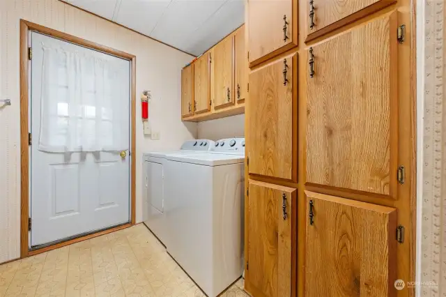 Laundry room with lots of cabinets.