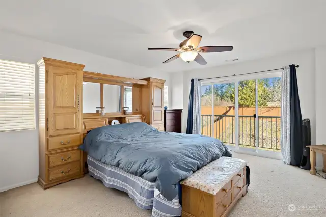 Large primary bedroom with balcony.  Plenty of space for King sized bed.