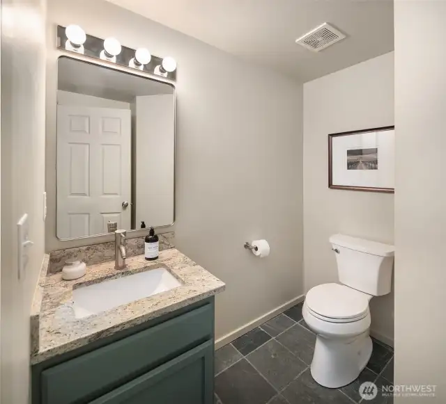 Powder room off the living area on the main level.