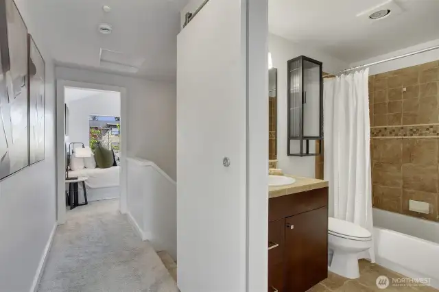 The bedrooms share a full bathroom upstairs off the hallway. (The other 3/4 bath is on the entry level).