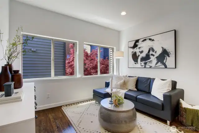 Inside, the living spaces on the (2nd) main floor are bright and airy, accented by hardwood floors, tall ceilings and abundant natural light. Windows face the nicely landscaped courtyard.