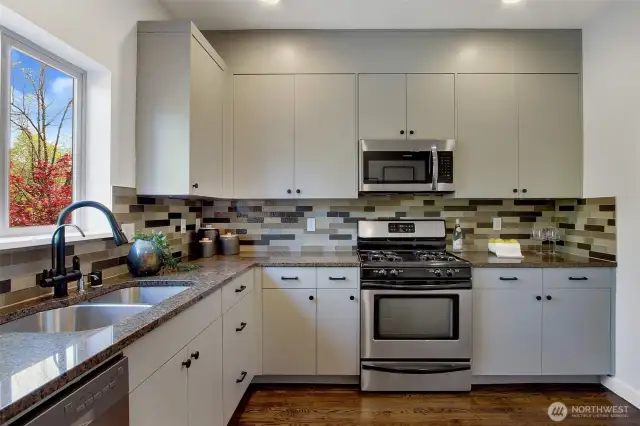 Tons of great storage space here for Costco-sized purchases. Watch the leaves change through the seasons on your maple tree as the sink overlooks your patio.
