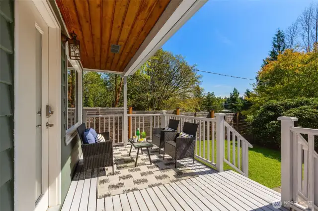 You will LOVE this covered, south-facing  porch! Ready for 4-season coffee sippin'!  Fully-fenced yard, veggie patch, low  maintence turf.