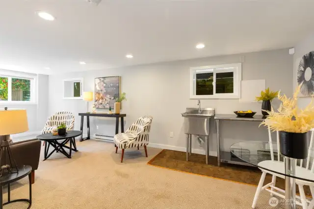 Lower level with separate entrance offers the  possibility for short term rental income RIGHT  NOW, easy upside potential as a full ADU, or  retain for a secondary rec room/home  theater + private bedroom.