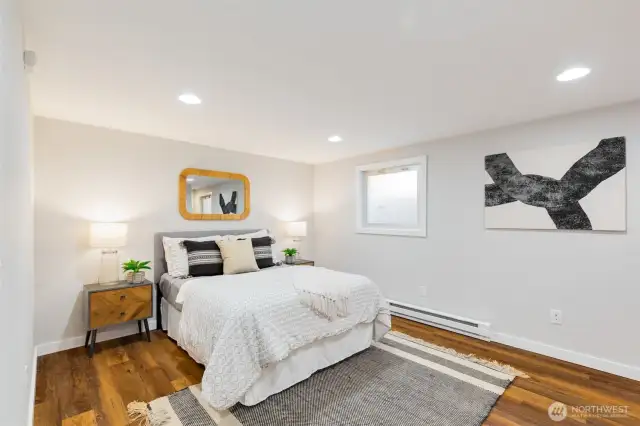 Lower level with separate entrance offers the  possibility for short term rental income RIGHT  NOW, easy upside potential as a full ADU, or  retain for a secondary rec room/home  theater + private bedroom.