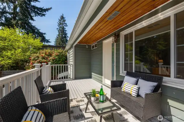You will LOVE this covered, south-facing  porch! Ready for 4-season coffee sippin'!  Fully-fenced yard, veggie patch, low  maintence turf.