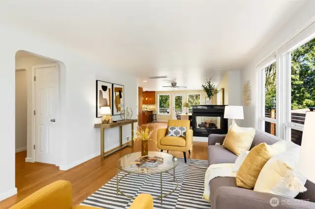 Expansive living room, dining room, and  kitchen with enchanting flow and natural  light from big windows on 3 sides! This will  be your daily hub.