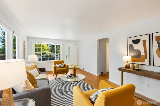 Expansive living room, dining room, and  kitchen with enchanting flow and natural  light from big windows on 3 sides! This will  be your daily hub.