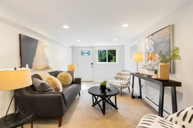 Lower level with separate entrance offers the  possibility for short term rental income RIGHT  NOW, easy upside potential as a full ADU, or  retain for a secondary rec room/home  theater + private bedroom.
