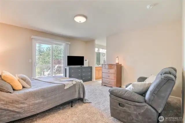 Primary bedroom with slider to the deck