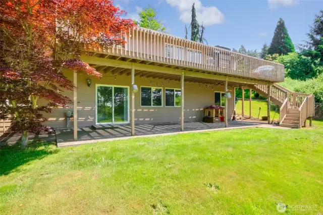 View of back patio and upper deck