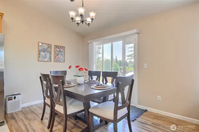 Kitchen dining area with slider to back deck