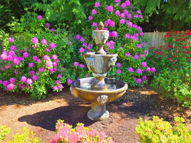 Stunning, vibrant colors and sound surround the front yard and entry adding to the tranquility this private estate provides