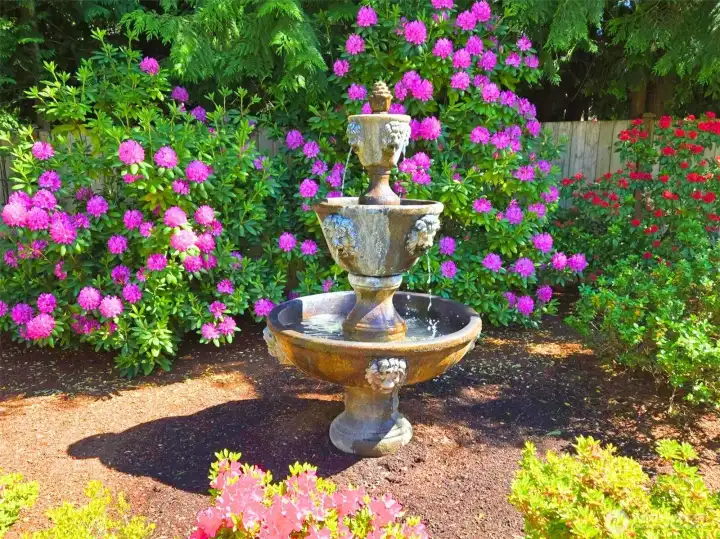 Stunning, vibrant colors and sound surround the front yard and entry adding to the tranquility this private estate provides