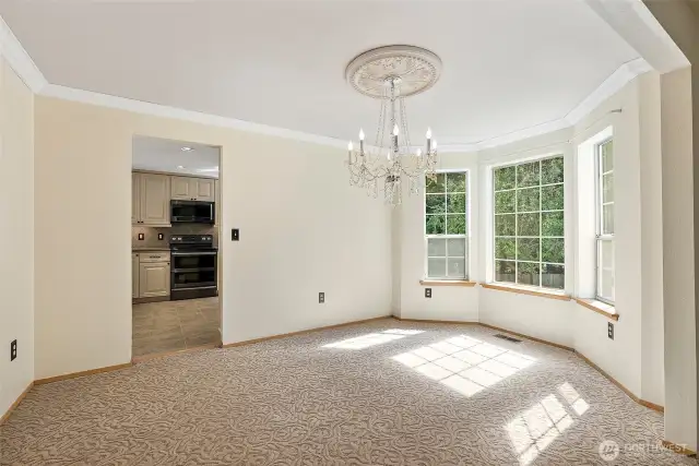 This Dining has spectacular views of the spacious side yard, with easy access in to the custom Kitchen...