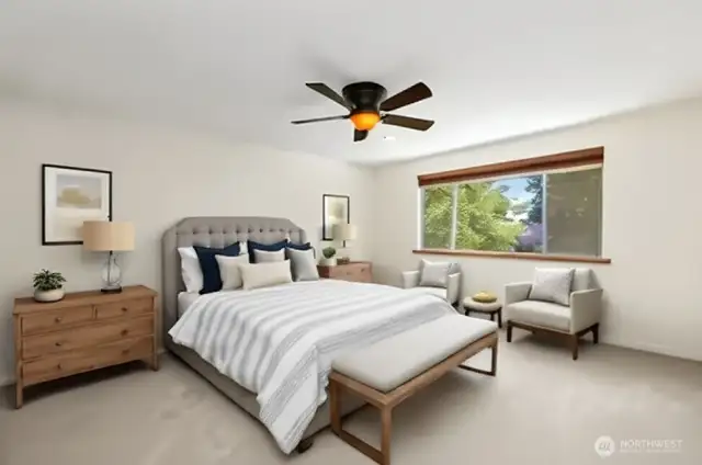 Virtually staged spacious primary bedroom.