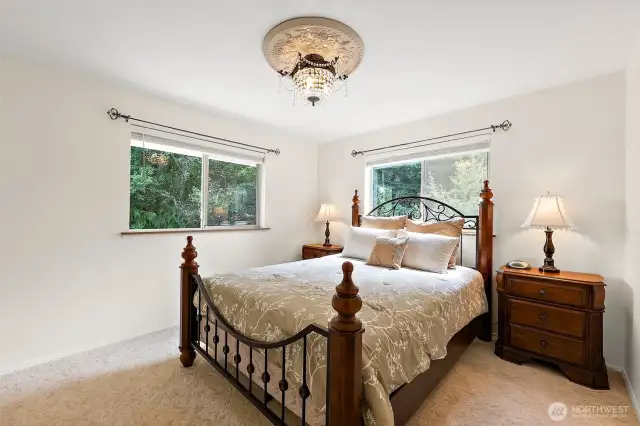 Spacious 2nd bedroom overlooking lush mature landscaping.
