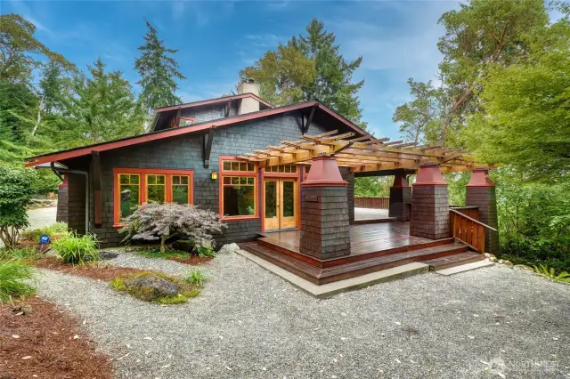 Gorgeous pergola covers a big deck right off the living room.