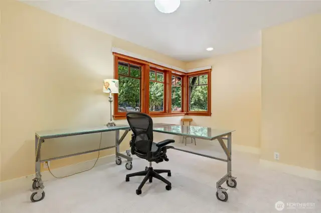 Two bedrooms with the same layout. This one is shown as an office.