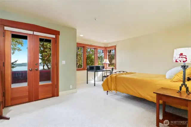 Primary bedroom with private deck and views of Mt Ranier.