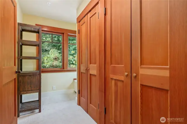 Large closets await you in this lovely dressing room with laundry chute.