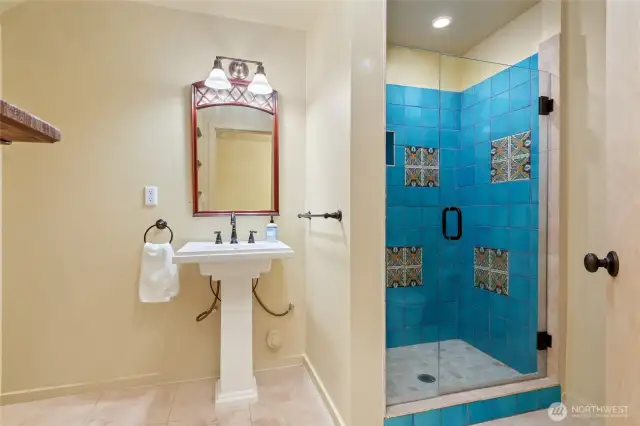 Basement bathroom, gorgeous tile shower with tile the seller brought home from Mexico.