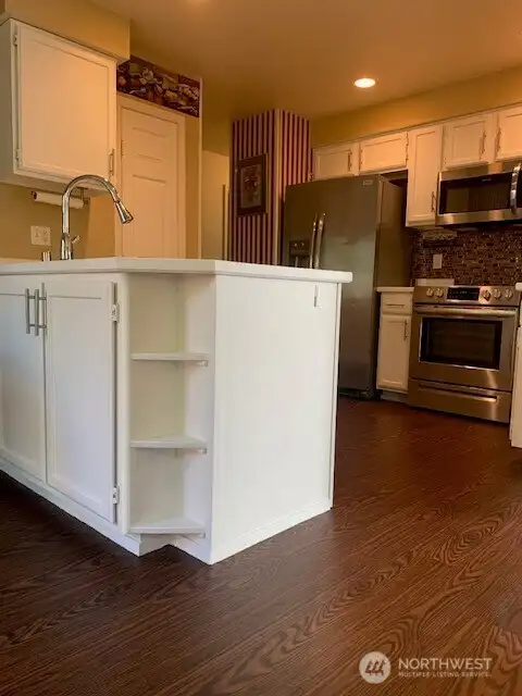 Kitchen with custom sink, faucet and stainless steel