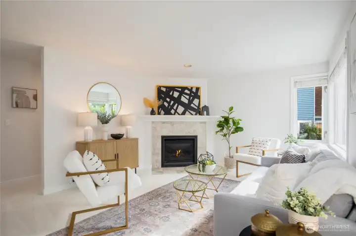 A bright and sunny living room makes a great first impression. New carpet and interior paint are inside.