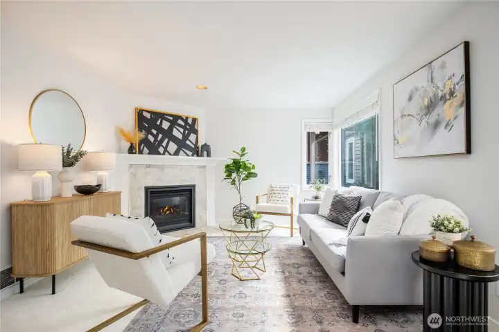 A south facing wall of windows and gas fireplace are great features in this room.