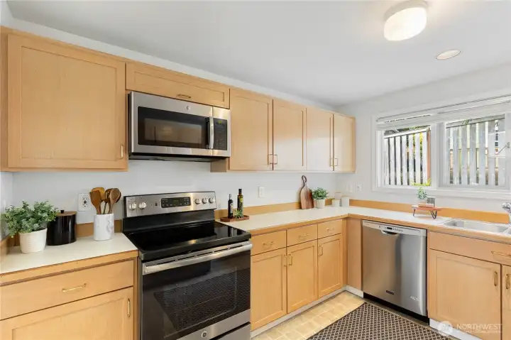 The nicely-sized kitchen with updated stainless steel appliances.