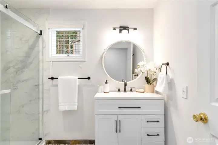 Back inside to the updated 3/4 bathroom on the main level.