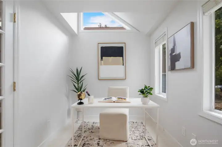 This wonderful connected space has walls of windows and an upper clerestory window for great light and style.
