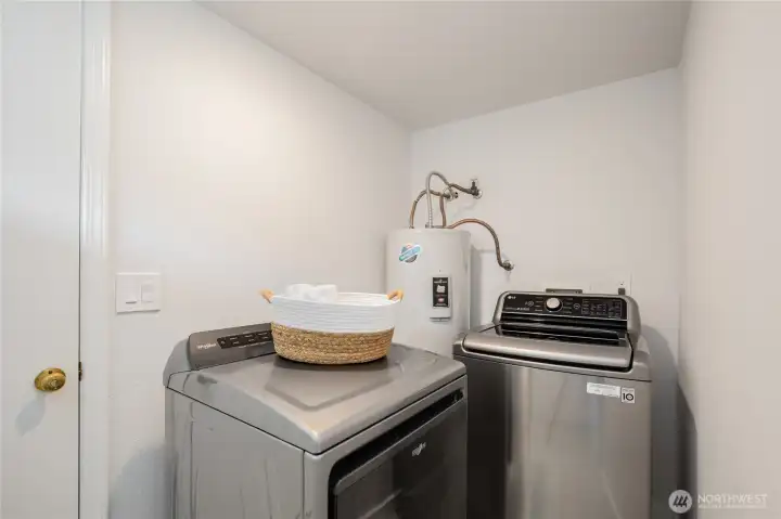 Back downstairs is the laundry area, which connects to the attached garage.