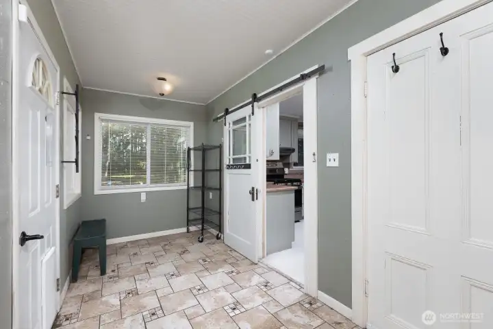 Sitting area/mudroom, backyard door.