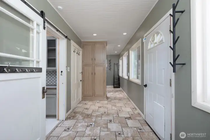 Laundry room area and backyard door, and entrance to downstairs basement.