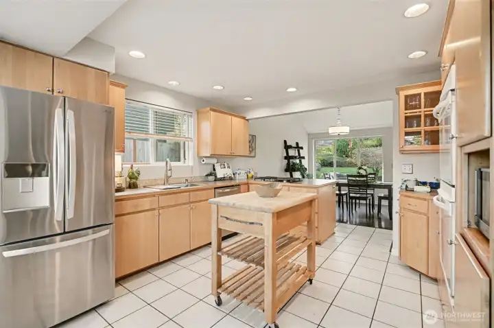 New gas cooktop, SS dishwasher, spacious sink & newer refrigerator.