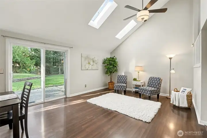 Bright and light featuring skylights, vaulted ceilings, LVP flooring throughout & a large fully-fenced yard.