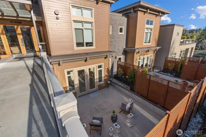 Looking down into the private courtyard, such an incredible space to have with a condo! Great entertaining space, or excellent place to Zen out!