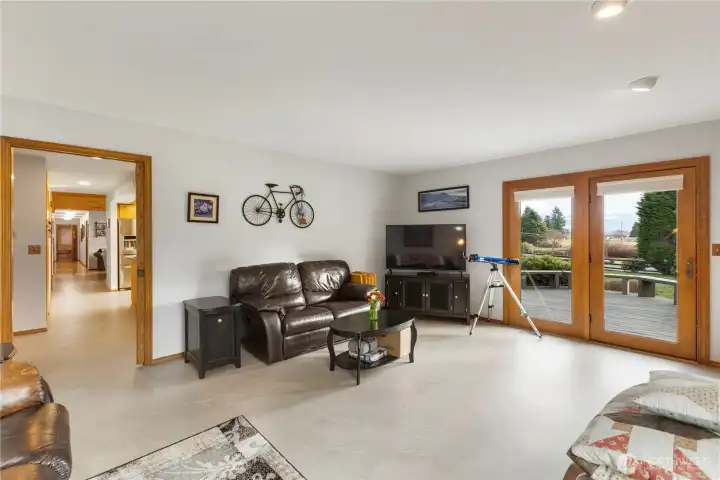 Family room with doors leading to the deck.