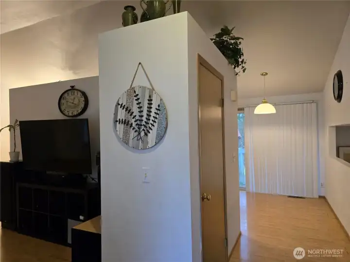 Entrance to home with living room to the left and kitchen eating area straight ahead.